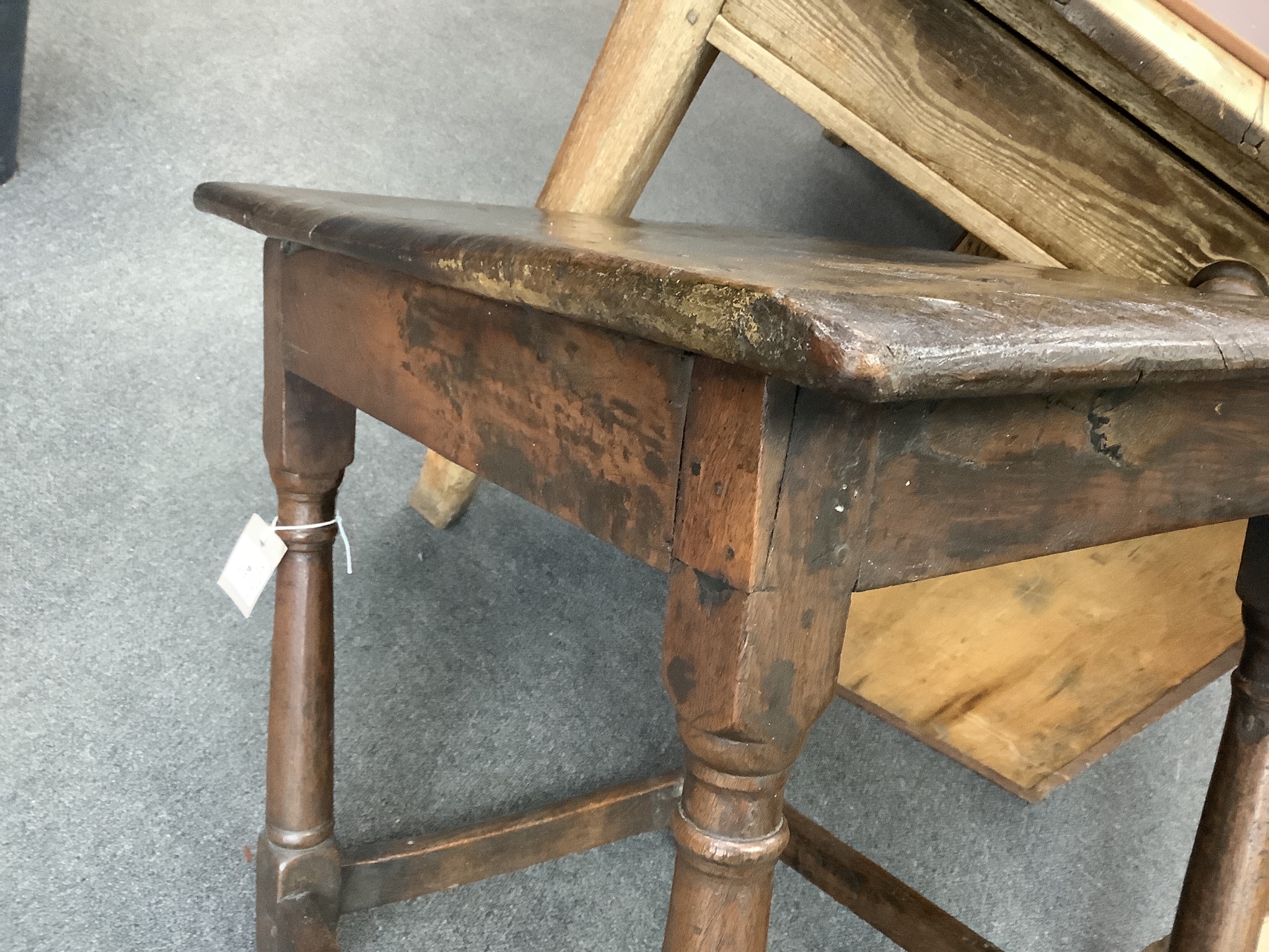 A 17th century rectangular oak small table with twin planked top, width 62cm, depth 52cm, height 61cm